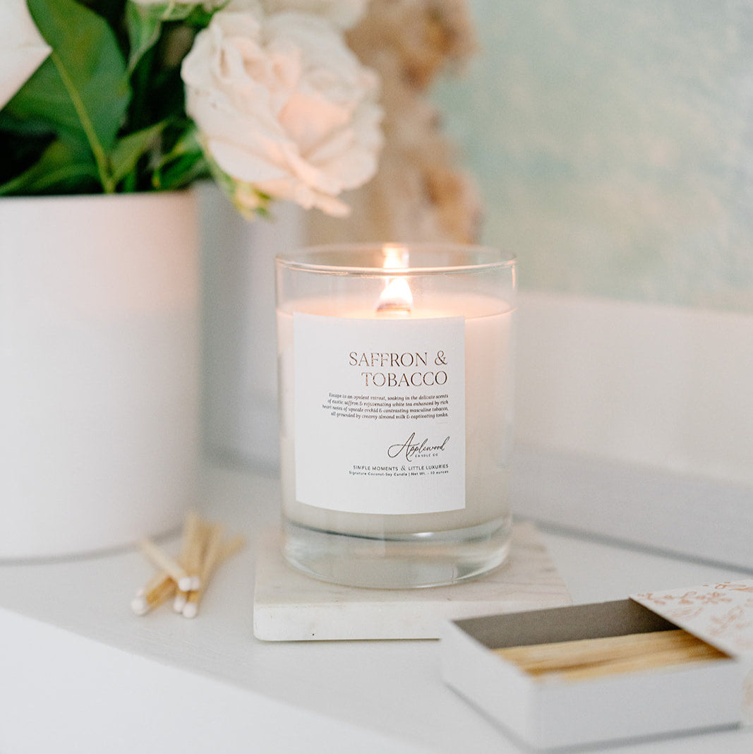 Lit Signature Saffron & Tobacco candle in glass jar