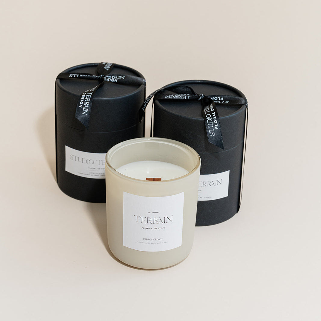 Personalized luxury candle with custom label and packaging.