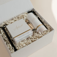 Luxury custom gift box with White Pumpkin & Smoke candle, Vetiver and Ember Moss room linen & mist, candle snuffer, wick trimmer and set of matches.