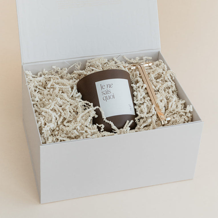 Luxury custom gift box with luxury candle and wick trimmer with custom label and packaging.