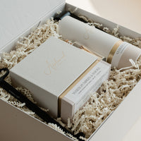 Luxury custom gift box with White Pumpkin & Smoke candle, Vetiver and Ember Moss room linen & mist, candle snuffer, wick trimmer and set of matches.