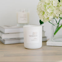 Lilac & Mimosa frosted glass candle with clear glass candle in background.