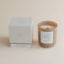 Luxury Vetiver & Ember Moss candle with box on beige backgound