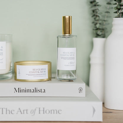 Sea Glass &amp; Coastal Musk gold travel tin candle with matching room and linen mist