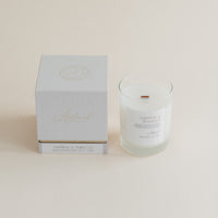 Saffron & Tobacco candle glass jar with box on beige background.