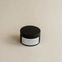 Travel Antique Leather & Cognac in tin can on beige background.