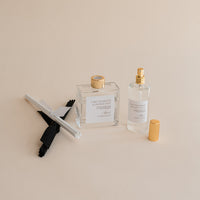 Reed Diffuser and Room and Linen Mist both in clear vessels with gold closures