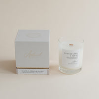 Candle and packaging with 'White Pumpkin & Tobacco' text on a beige background