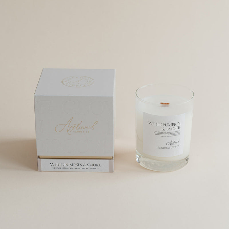 Candle and packaging with 'White Pumpkin & Tobacco' text on a beige background